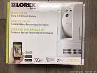 Box front showing Lorex branding, model LNC254, wireless HD pan & tilt network camera description, and image of camera.