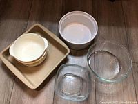 Top view showing all bowls and baking dish including Pyrex glass bowl, Rubbermaid bowl, and stoneware baking dish