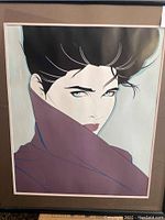 Framed signed silkscreen print showing stylized portrait of woman with high collar and short black hair.