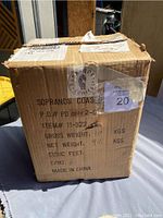Outer shipping box labeled SOPRANOS COASTERS with gross and net weight details.