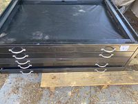 Front view of the black steel 5 drawer map storage cabinet showing drawer handles and locks.
