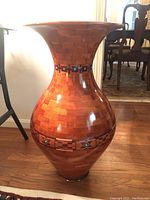 Full front view of vase on hardwood floor