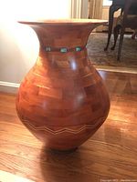 Full front view of the floor vase showing overall shape and finish