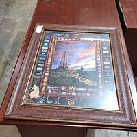 Framed oil industry themed wall art print measuring approximately 24x30 inches with decorative border and logos.