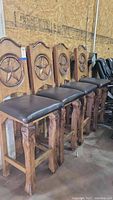 Four bar stools in a row showing overall lot