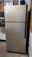 Front view of stainless steel top-freezer refrigerator