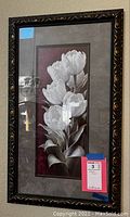 Front view of the framed floral print showing white tulips on a dark pink background with a decorative frame.