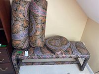 Bench and cushions showing full view of upholstery and pattern.