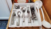 Drawer of Retroneu textured design stainless steel flatware assorted forks, spoons and knives