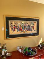 Front view of framed Japanese silkscreen print hanging on wall