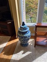 Front view of jar with lid in room