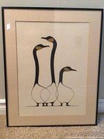 Full view of framed art showing three stylized birds