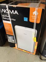 Front of sealed box showing NOMA branding and 42 pint capacity