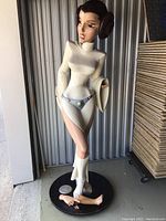 Full front view of 54 inch tall resin statue showing overall pose, white gown, silver belt and brown hair buns