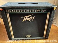 Full view of Peavey combo amplifier with visible control panel, speaker grille, and protective corners.