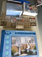 Photo showing multiple bedding items including 100% cotton flannel and percale sheets from Hanes and other brands with size tags visible.