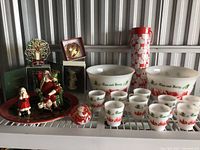 Full lot showing all items on metal shelf including punch bowls, cups, thermos, and figurines