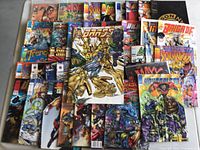 Collection of Image Plus comic books showing various titles with colorful illustrated covers, stacked and displayed flat on a surface.