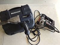 Mastercraft electric impact wrench and Walter electric jigsaw together showing cables and carrying case for wrench