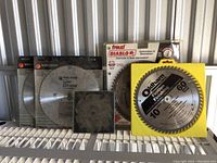 Overview of all six saw blades showing various brands and packaging.