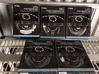 Five boxes of Meil Ultra Flex LED rope lights, stacked showing front of boxes with product image and details.