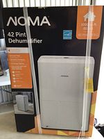 Front of boxed NOMA 42 Pint Dehumidifier