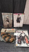Four sealed ladies costumes in size L/M including themed outfits as police officer, raccoon, 1920s style flapper couple costume, and pop diva with fishnet stockings and black boots.