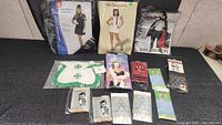 Photo of ladies costumes including flight attendant, nurse, devil, maid costumes plus assorted accessories such as stockings and gloves.