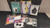 Lot of men's costumes and accessories shown together in packaging