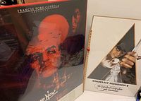 Both framed posters together, showing the Apocalypse Now poster on the left and A Clockwork Orange on the right in their frames.