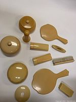 Full overview of all vintage ivory dresser pieces laid out on a white background showing condition, shapes, and sizes.