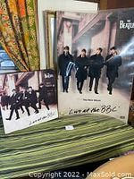 Two-piece lot showing large display and square box on striped surface