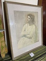 Framed print of Woman In White by Pablo Picasso, side angle showing frame and matting.