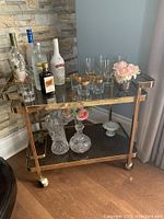 Front view of cart with bottles and glassware (items not included)