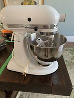 Mixer angled view showing body, bowl, and power cord