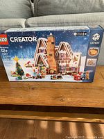 Front of unopened box showing LEGO Creator Expert Gingerbread House with Christmas theme.