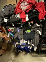 Shelves stocked with folded NFL apparel