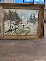 Framed watercolour landscape painting showing a forest scene with a stream, window in background, and auction tag number 350.