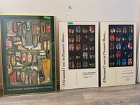 Framed prints of shoe collections: one from Bata Shoe Museum and two by Teodoro Dragonieri.