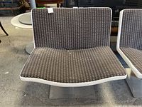 Front view showing the patterned upholstery and contoured seat shape