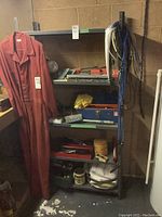 Full view of shelving unit with various items stored (not included) to demonstrate structure and condition.
