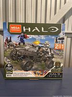 Front of Mega Construx Halo Infinite UNSC Razorback Blitz box, showing vehicle build and characters with 303 pieces, recommended age 8+.