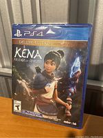 Front cover of PS4 game Kena: Bridge of Spirits Deluxe Edition in sealed case