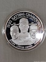 Front side of the coin showing 1993 Batting Champions text and embossed images of three players with names and statistics.