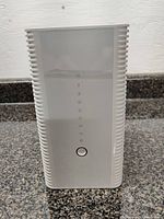 Front view of Hitron CODA-4582U router showing LED status indicators and power button.