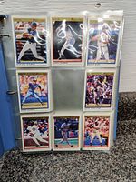 Page of nine O-Pee-Chee Premier baseball cards showing players batting and fielding.