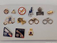 Lot of 14 police collector pins with various police-related designs including badges, vehicles, handcuffs, and symbols.