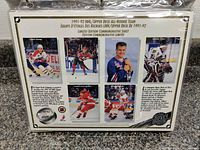 Photo of 1991/92 Upper Deck NHL All-Rookie Team Limited Edition Commemorative Sheet displaying photos of six hockey rookies.