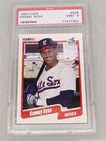 Front view of 1990 Fleer Sammy Sosa Rookie Card in PSA graded slab showing player portrait and card details.