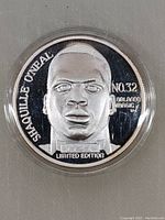 Close-up of the coin's obverse showing Shaquille O'Neal's portrait and inscriptions including Orlando Magic and Limited Edition.